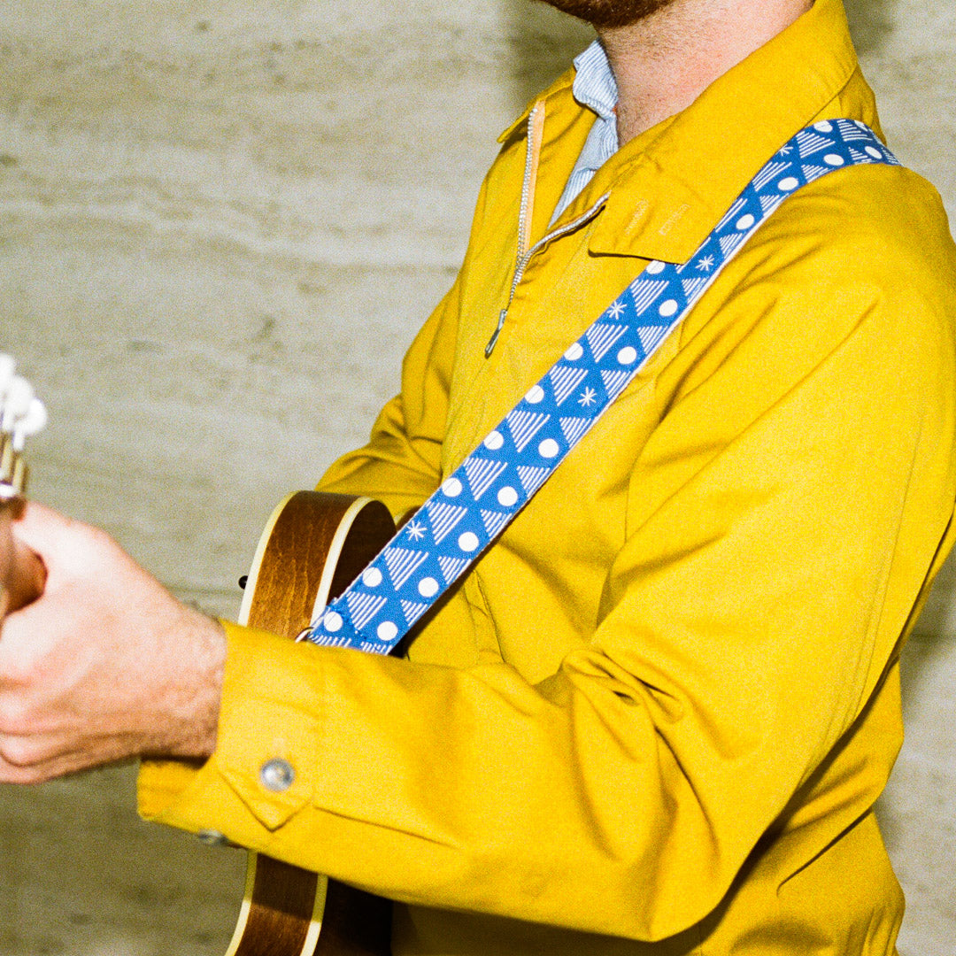 Real Estate's bassist Alex Bleeker designed this skinny guitar strap for Original Fuzz made with blue cotton and silkscreened by Grand Palace with white ink in Nashville, TN. 