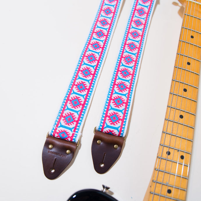 Close-up of the vintage jacquard pattern in the academy street guitar strap