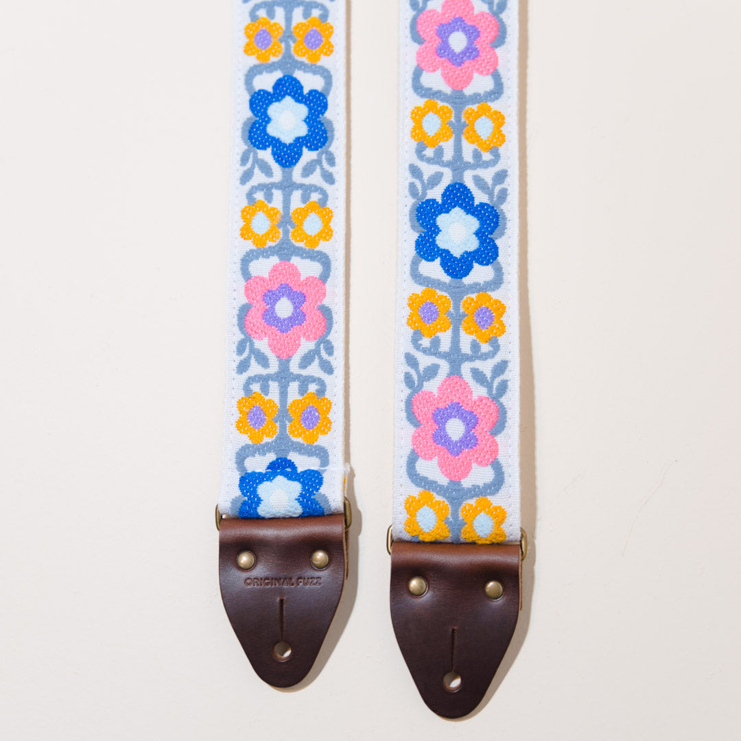 Close-up view of the floral jacquard used to make this guitar strap