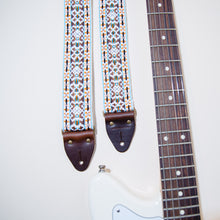 Another view of the vintage guitar strap in Merrimon Ave with a Fender Jaguar