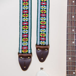 Featured photo of the geometric jacquard that makes our vintage guitar strap in Rhododendron Ave