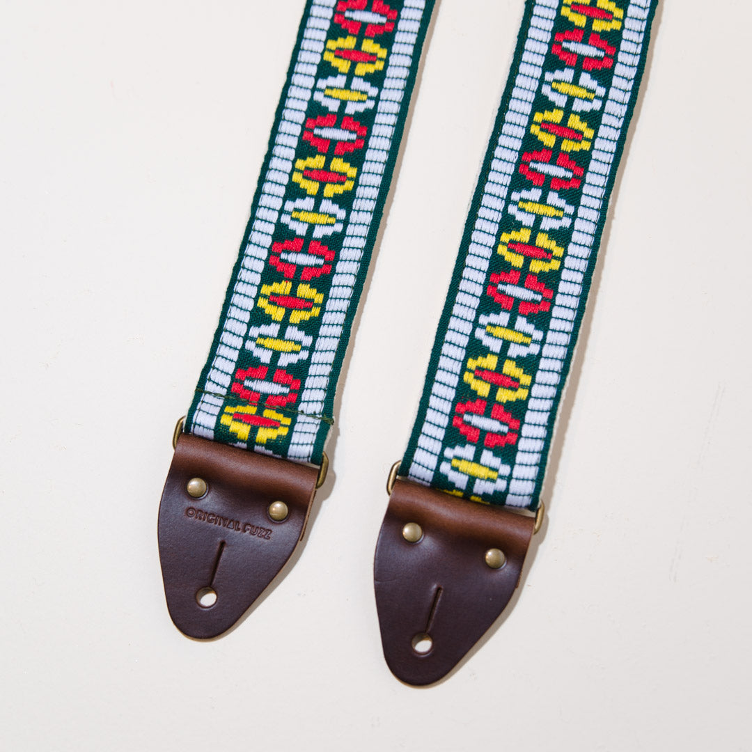 Close-up of the brown horween leather end tabs on the The Vintage Guitar Strap in Rhododendron Ave
