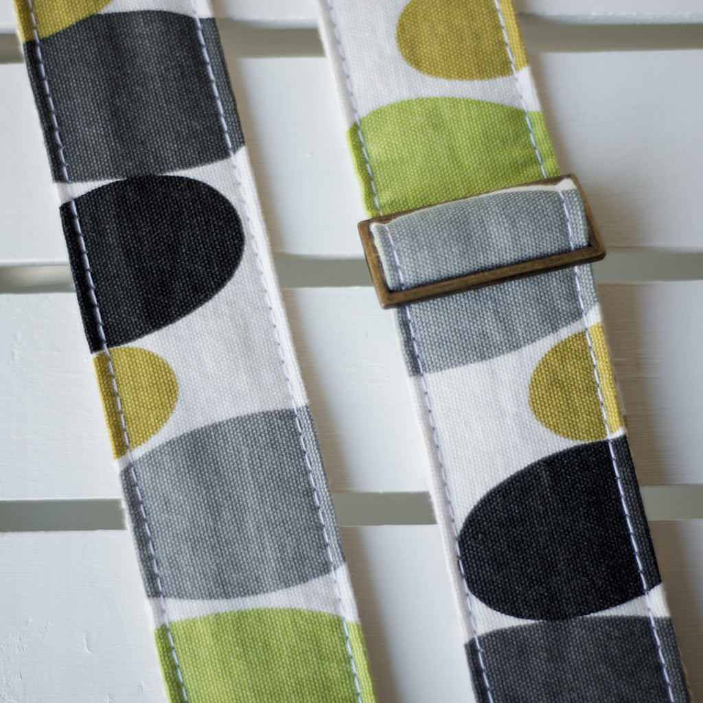 Vintage guitar strap with a retro lime green and black circle design made by Original Fuzz in Nashville, TN. 