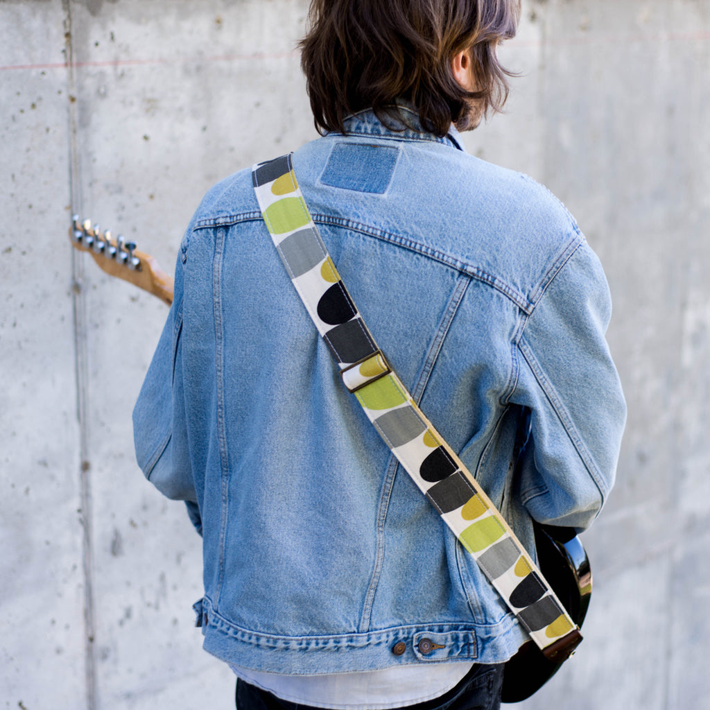 Vintage guitar strap with a retro lime green and black circle design made by Original Fuzz in Nashville, TN. 