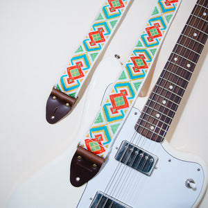 The vintage guitar strap in Town Mountain Road with a white Fender Jaguar